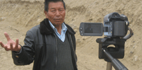 chewang norphel speaking to the video camera about artificial glaciers