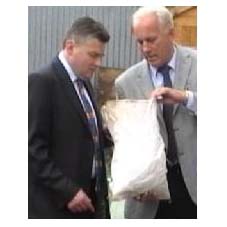 The Minister is shown insulation material