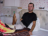 Ayob lies on his bed in Bournemouth